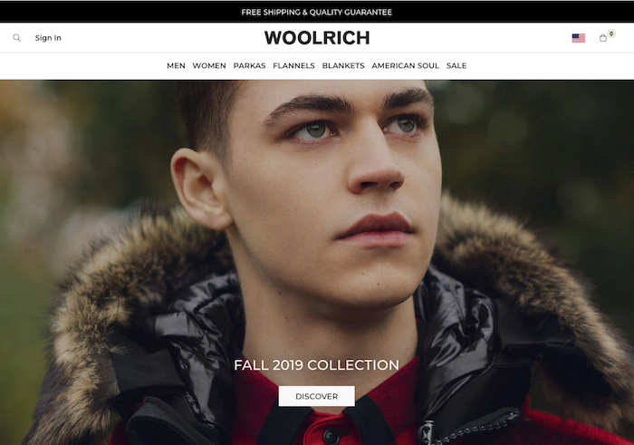 Close-up photo of young white man wearing parka by Woolrich
